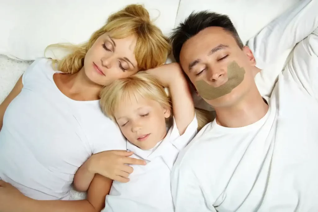 A family of three people sleeping